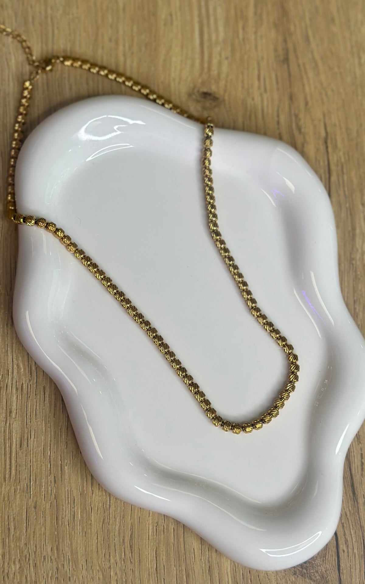 Collier ras de cou perlé doré